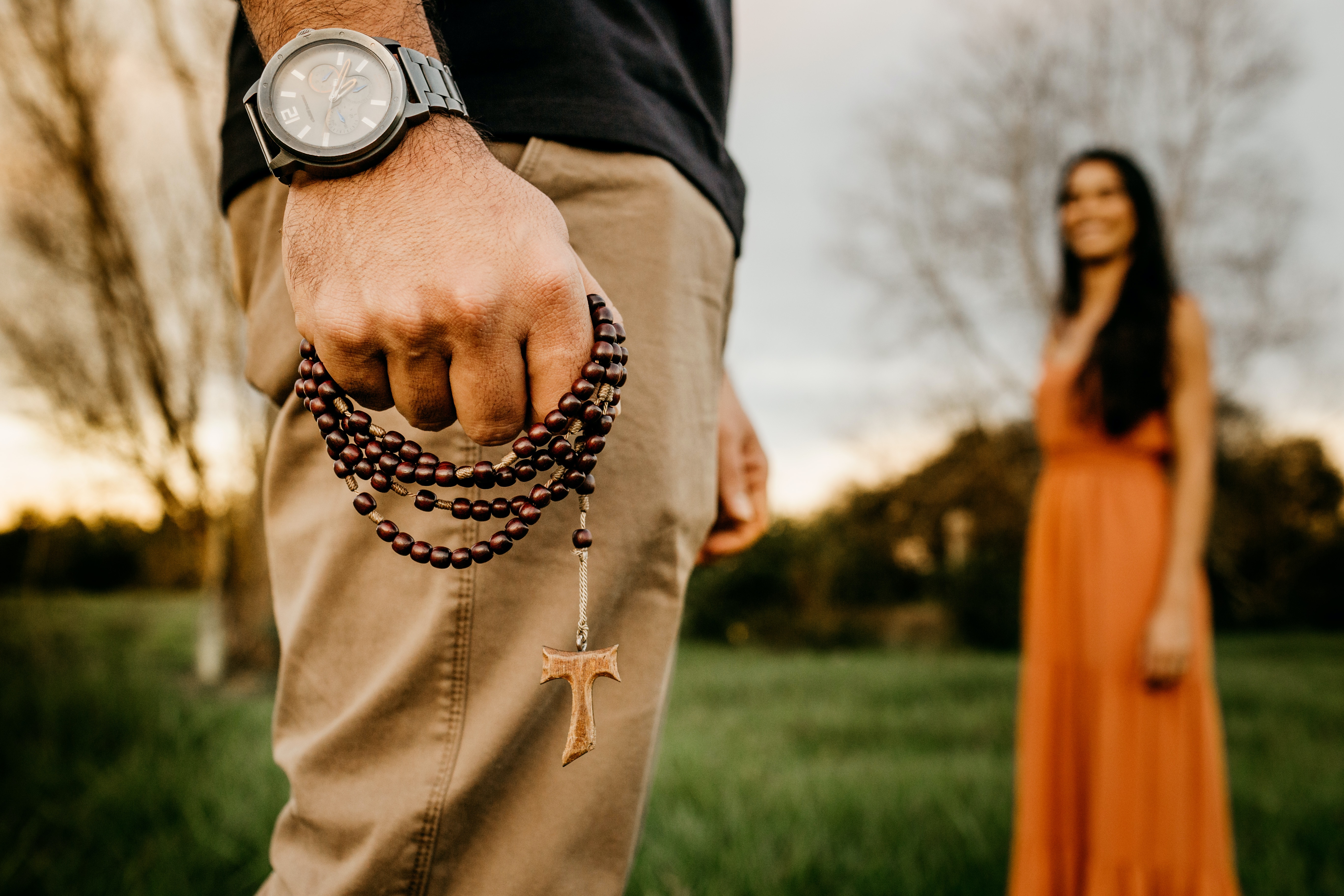 woman and men with rosary